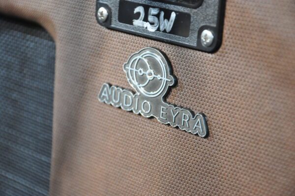 A close up of the logo on an audio extra car.