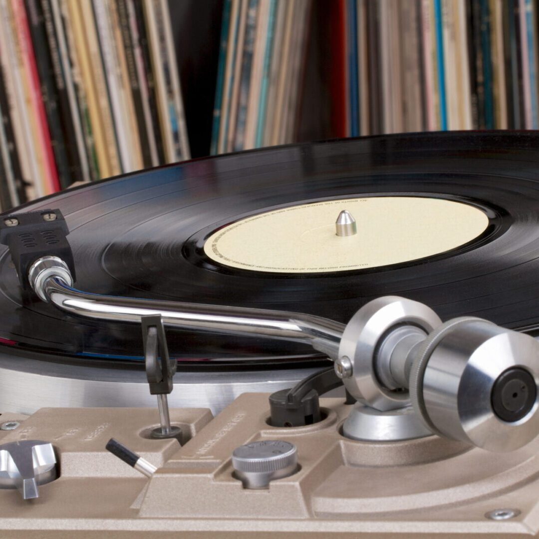 A record player with some records on the back